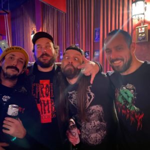 Four guys making faces.