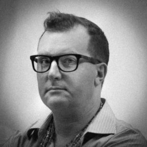 Picture of a man wearing glasses.