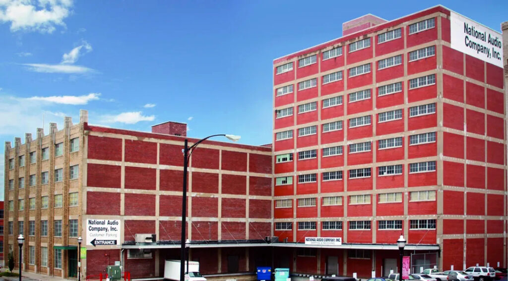 a red building with "National Audio Company" on the side
