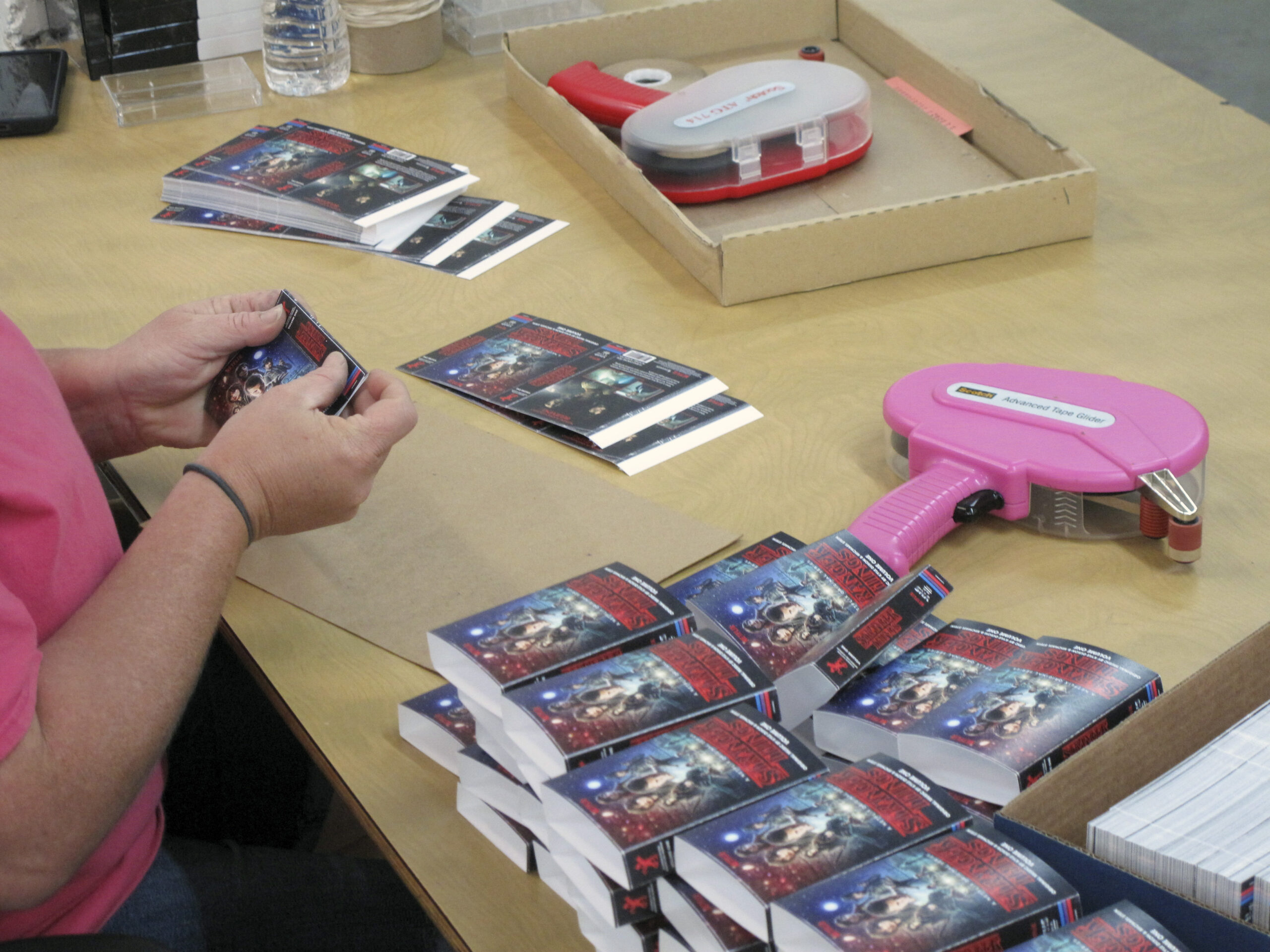 Norelco sleeves are folded and assembled by hand