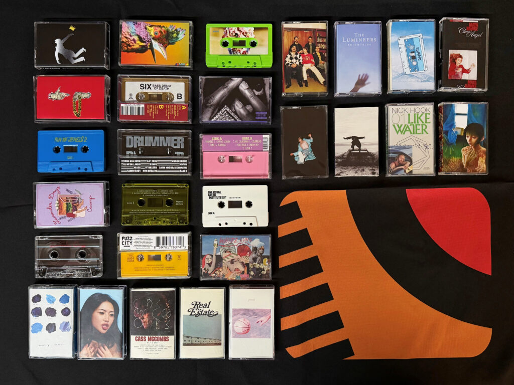 a variety of cassette tapes laid out flat