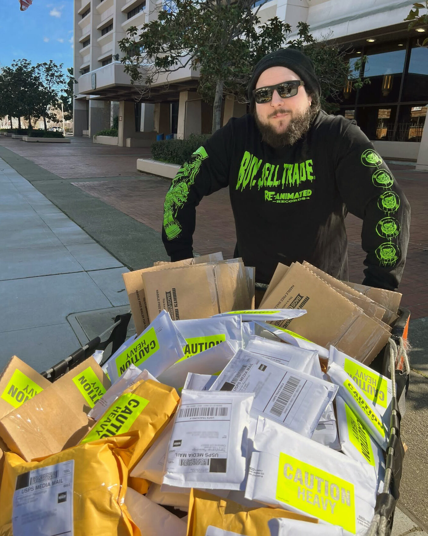 James Rauschenberg with a cart full of packages